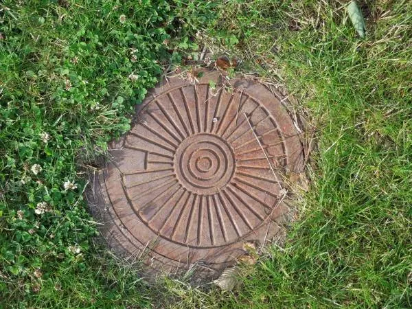 How to Hide Sewer Cover in Yard