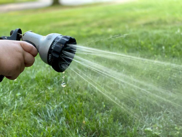 What temperature is too cold to water grass
